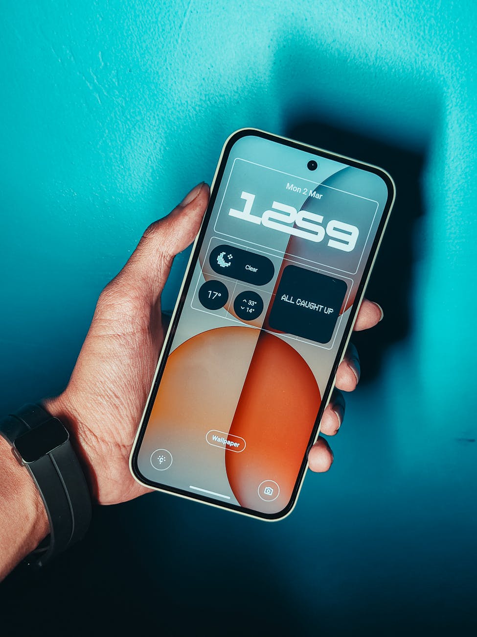 hand holding smartphone with modern interface displayed